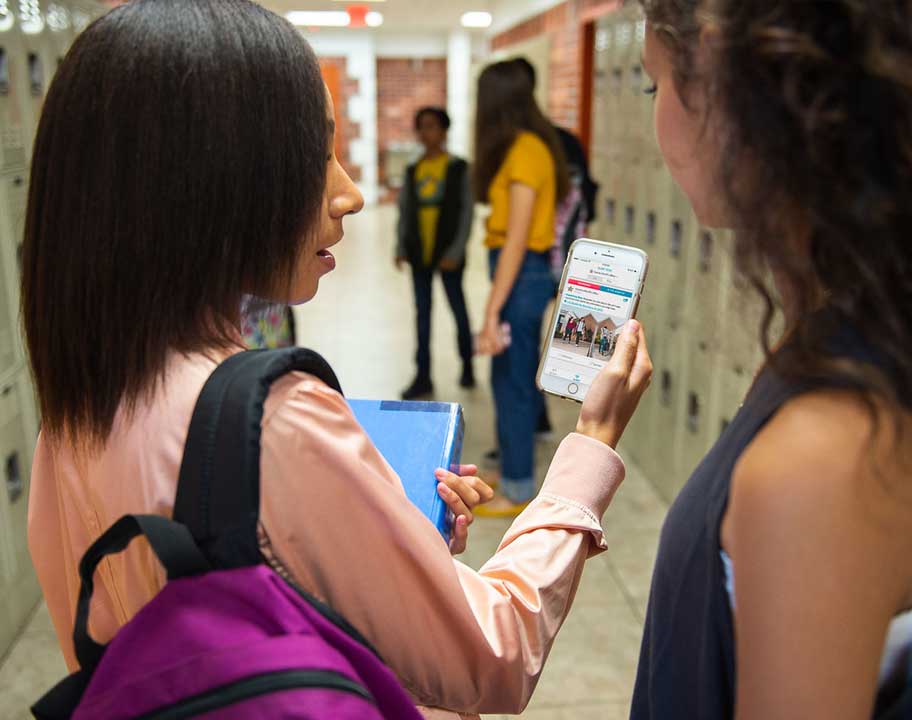 students watching SaferWatch app on phone