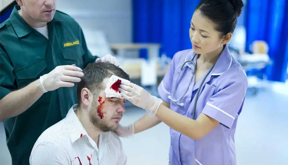 Nurses attending injured patient