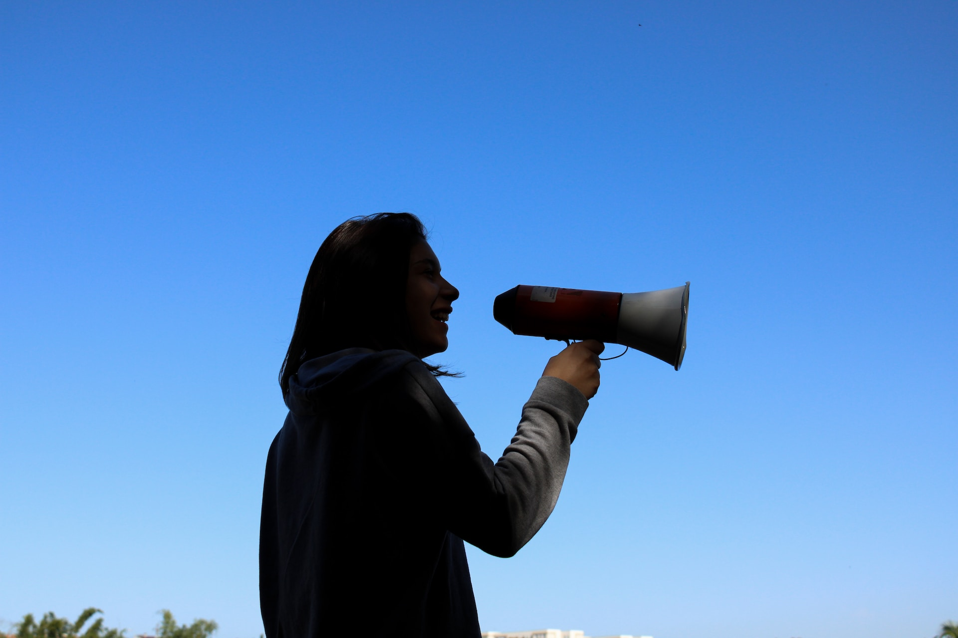 An image of a person using a mass notification system to send out emergency alerts