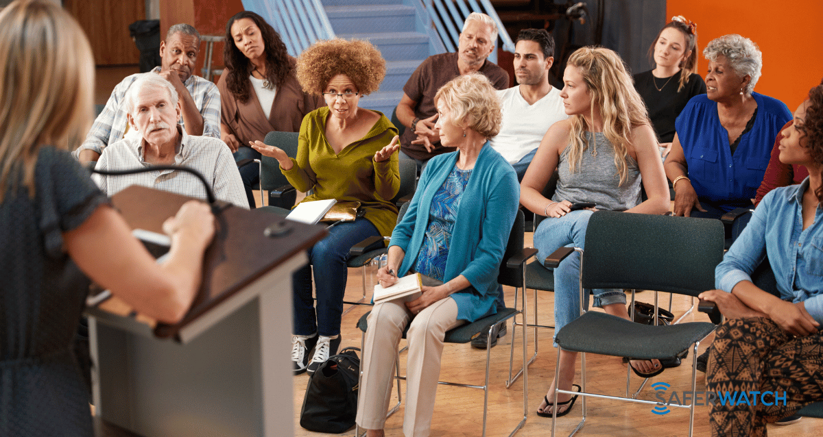 An image showing a group of neighbors looking out for each other, practicing neighborhood safety tips as part of a Neighborhood Watch program.