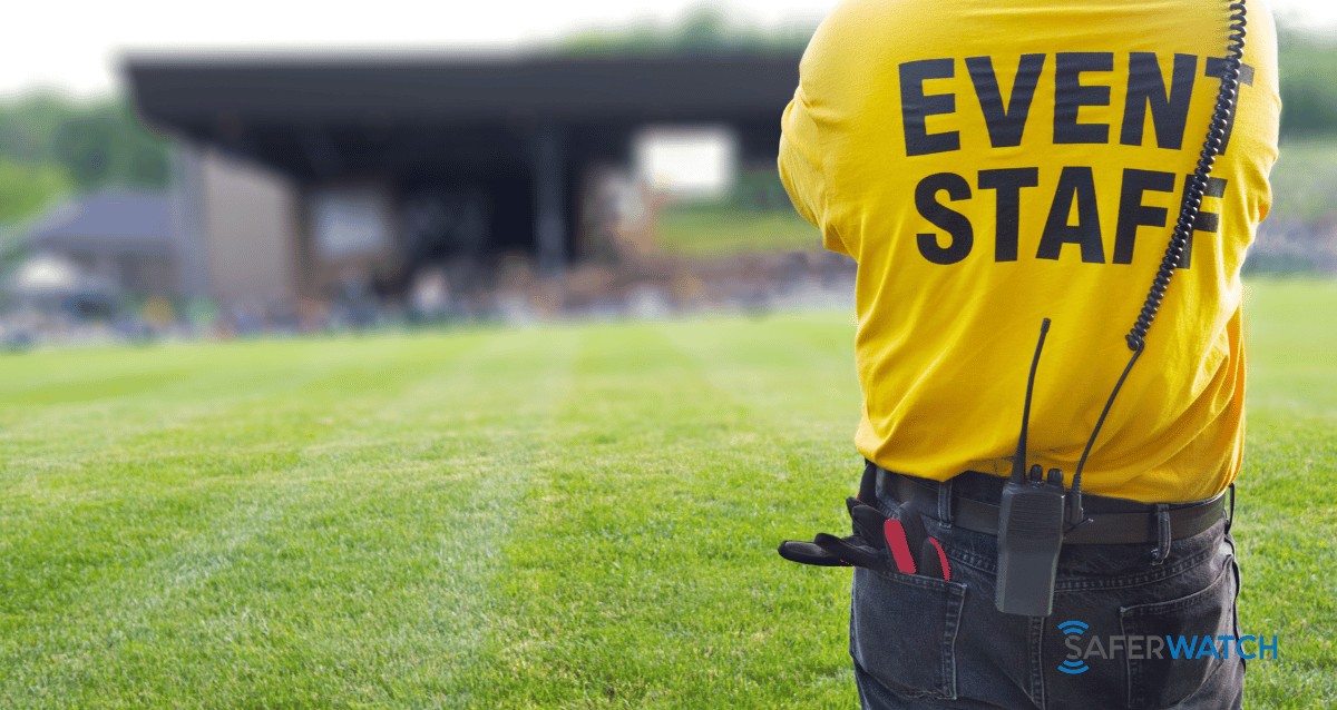 A security guard monitoring a large scale event